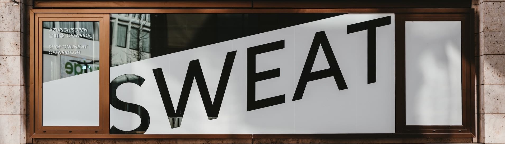 A sign saying sweat