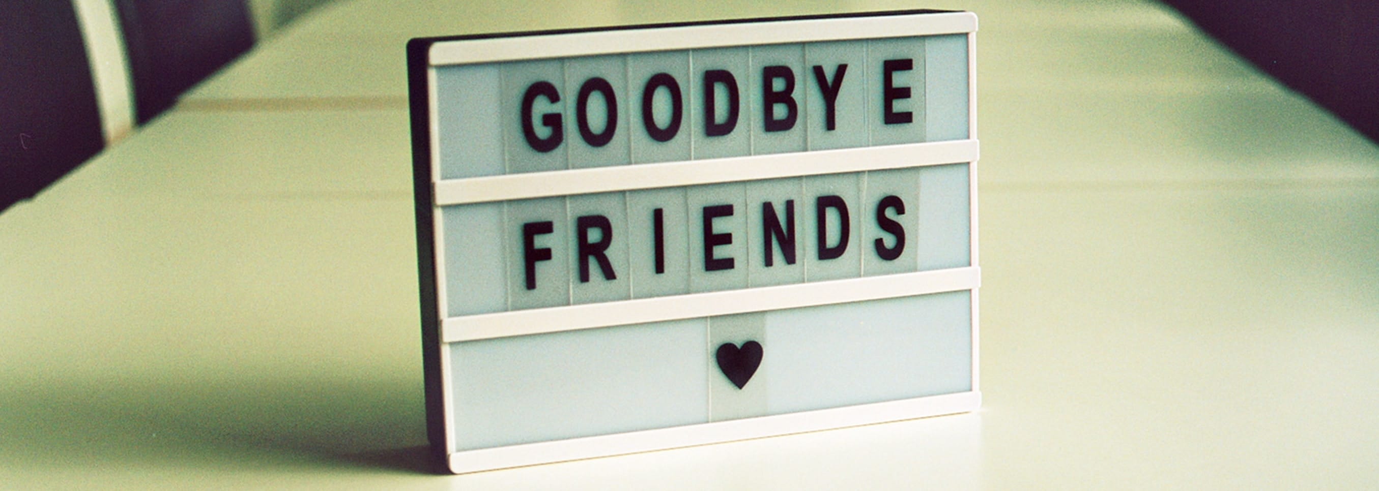 A cinema light box showing the words "Goodbye Friends"