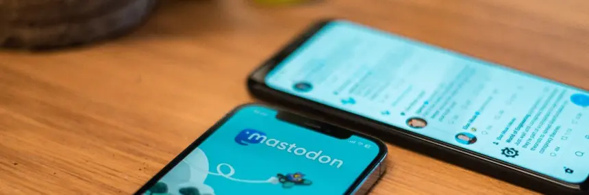 Two mobile phones showing the Mastodon website